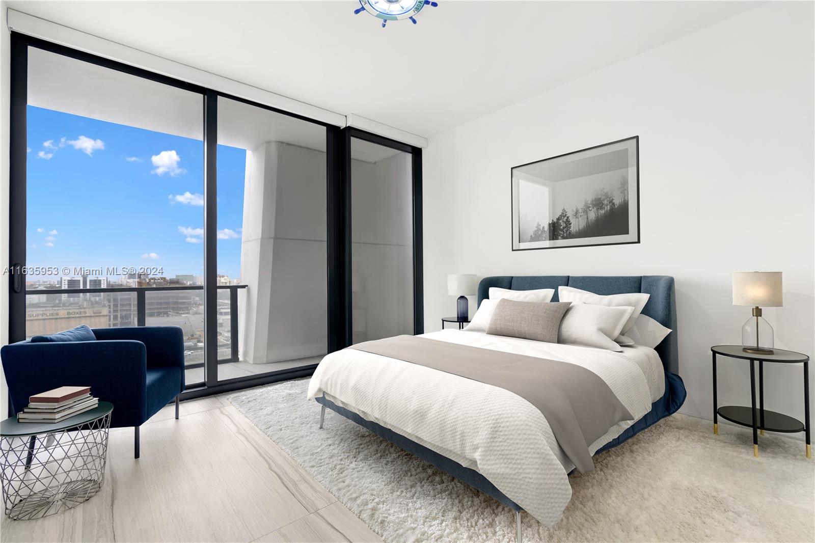 1000 Biscayne Boulevard, Unit 1202 Miami, FL 33132 - Photo 17 of 23 a bedroom with a large bed and a balcony view