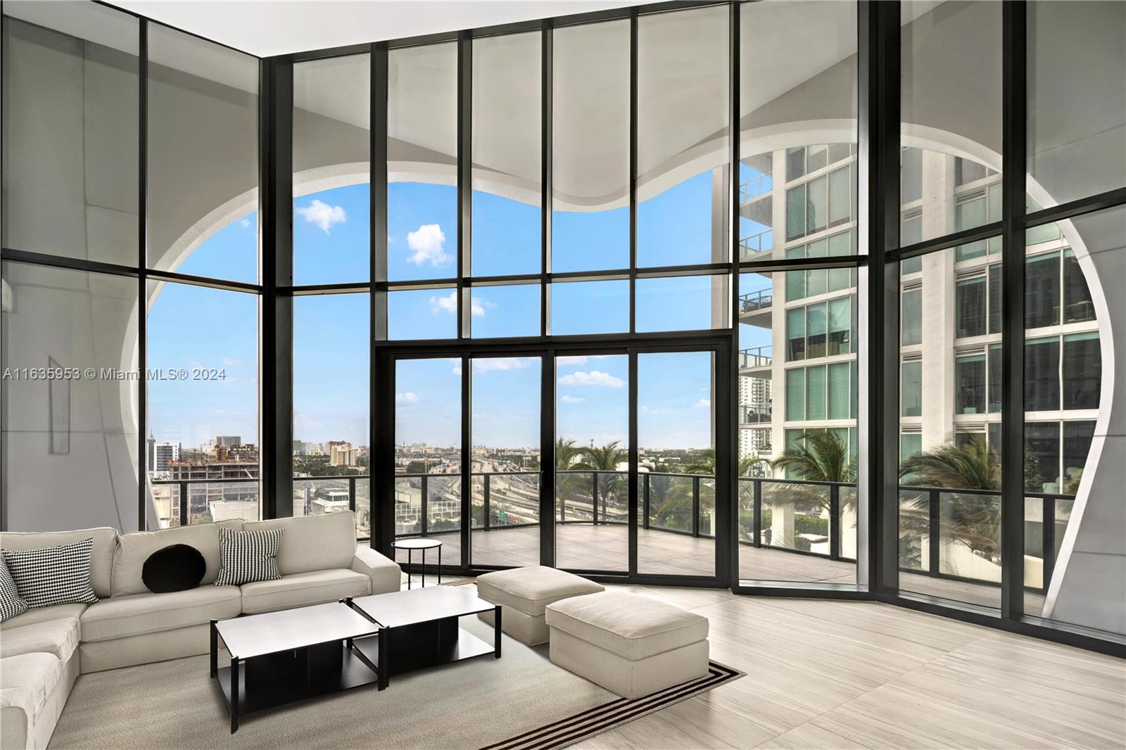 1000 Biscayne Boulevard, Unit 1202 Miami, FL 33132 - Photo 8 of 23 a living room with furniture and a large window