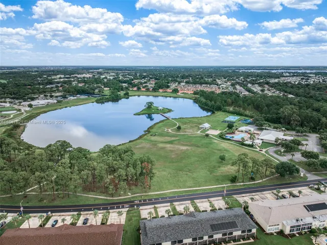 an aerial view of a house with outdoor space