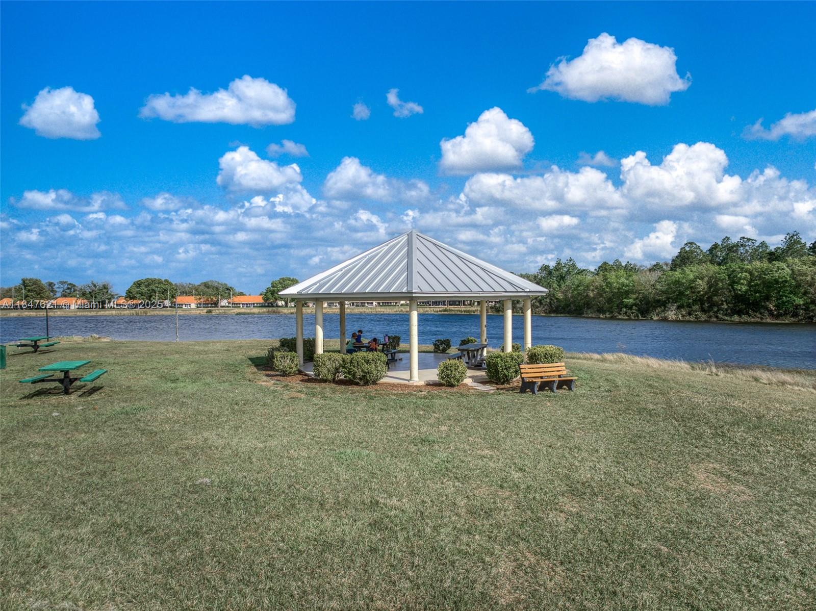 4715 Leucadendra Drive Sebring, FL 33872 - Photo 30 of 50 a view of a house with backyard porch and sitting area
