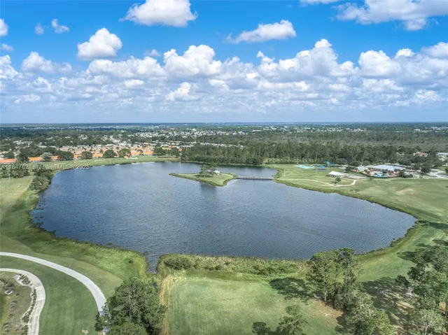a view of a backyard with swimming pool