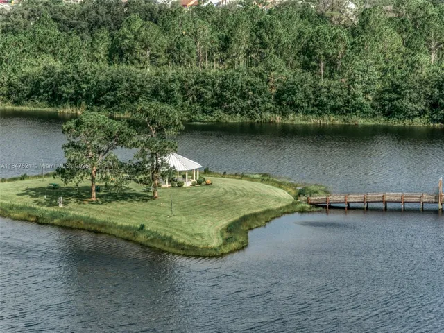 a view of a backyard with sitting area
