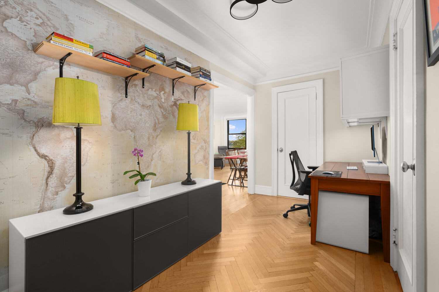 395 Riverside Drive, Unit 7C Manhattan, NY 10025 - Photo 3 of 10 a living room with a couch and a desk