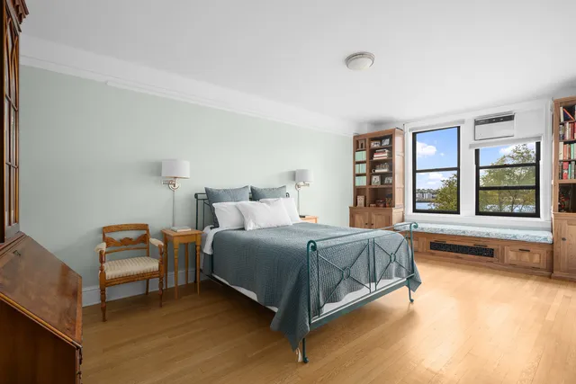 a living room with a couch and a desk