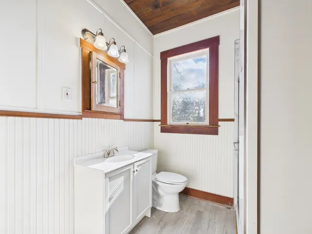 a white toilet sitting next to a bathroom sink