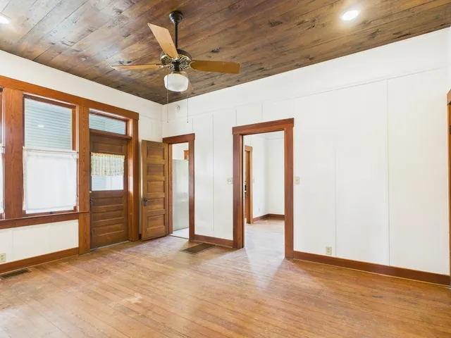 a view of an empty room with a window