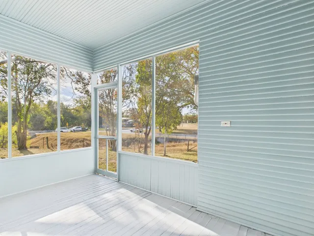 a view of a room with a large window