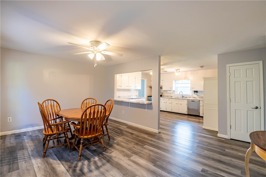 1823 Cooper Drive Decatur, IL 62526 - Photo 4 of 21 a view of a dining room with furniture and wooden floor