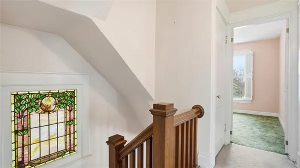 a view of a hallway with windows