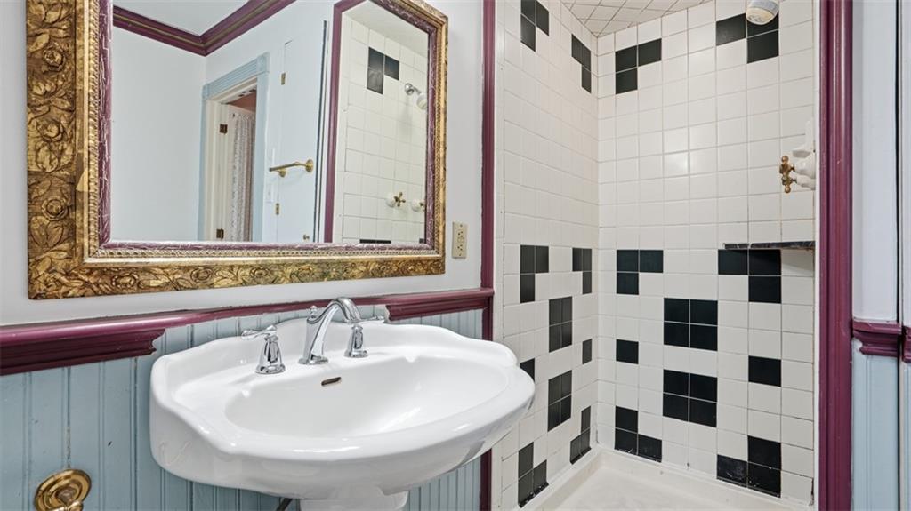 2129 Vodeli Street Pittsburgh, PA 15216 - Photo 26 of 35 a bathroom with a sink and a mirror