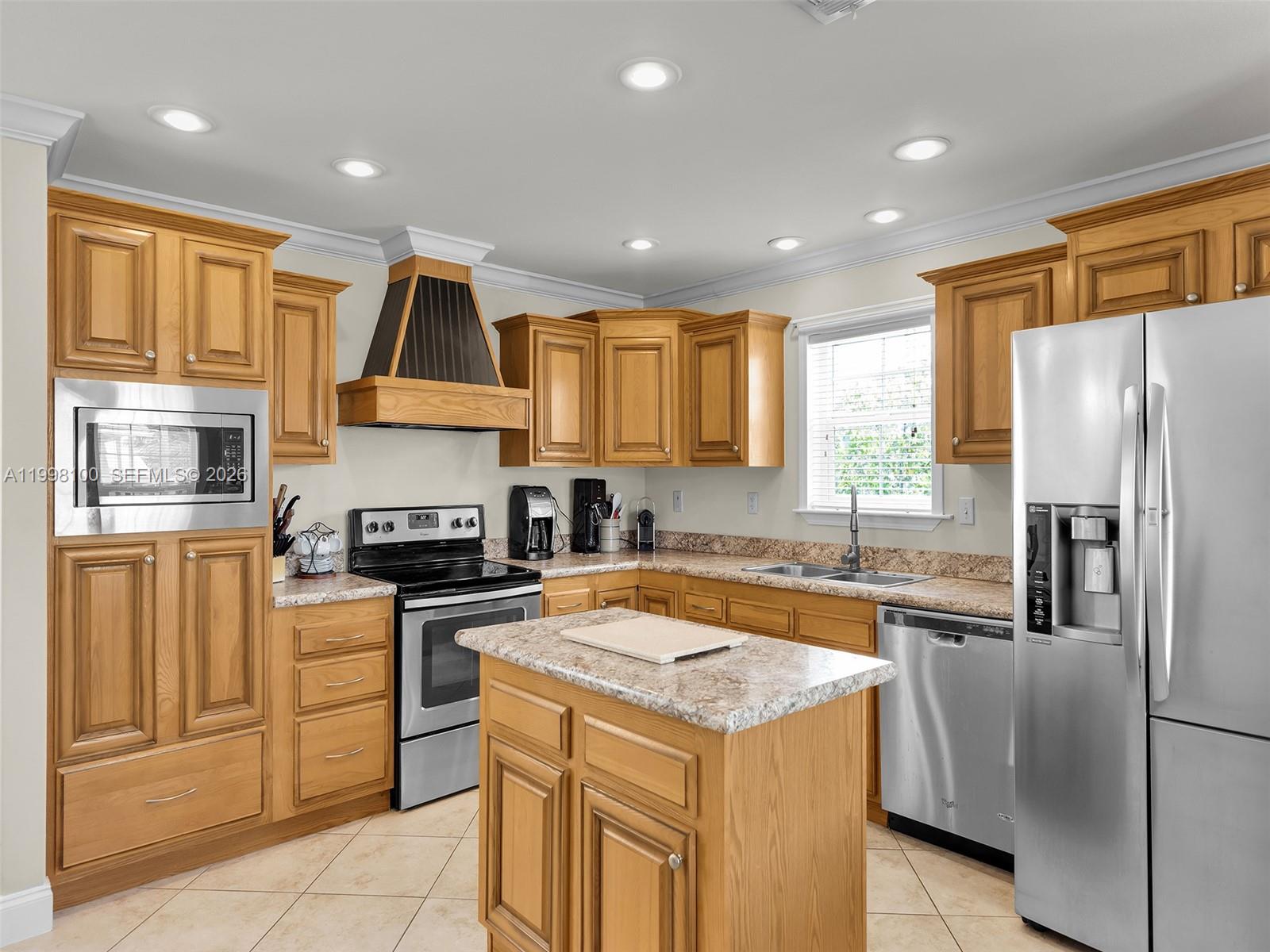 437 Pirates Road Summerland Key, FL 33042 - Photo 17 of 39 a kitchen with a refrigerator sink and stove top oven