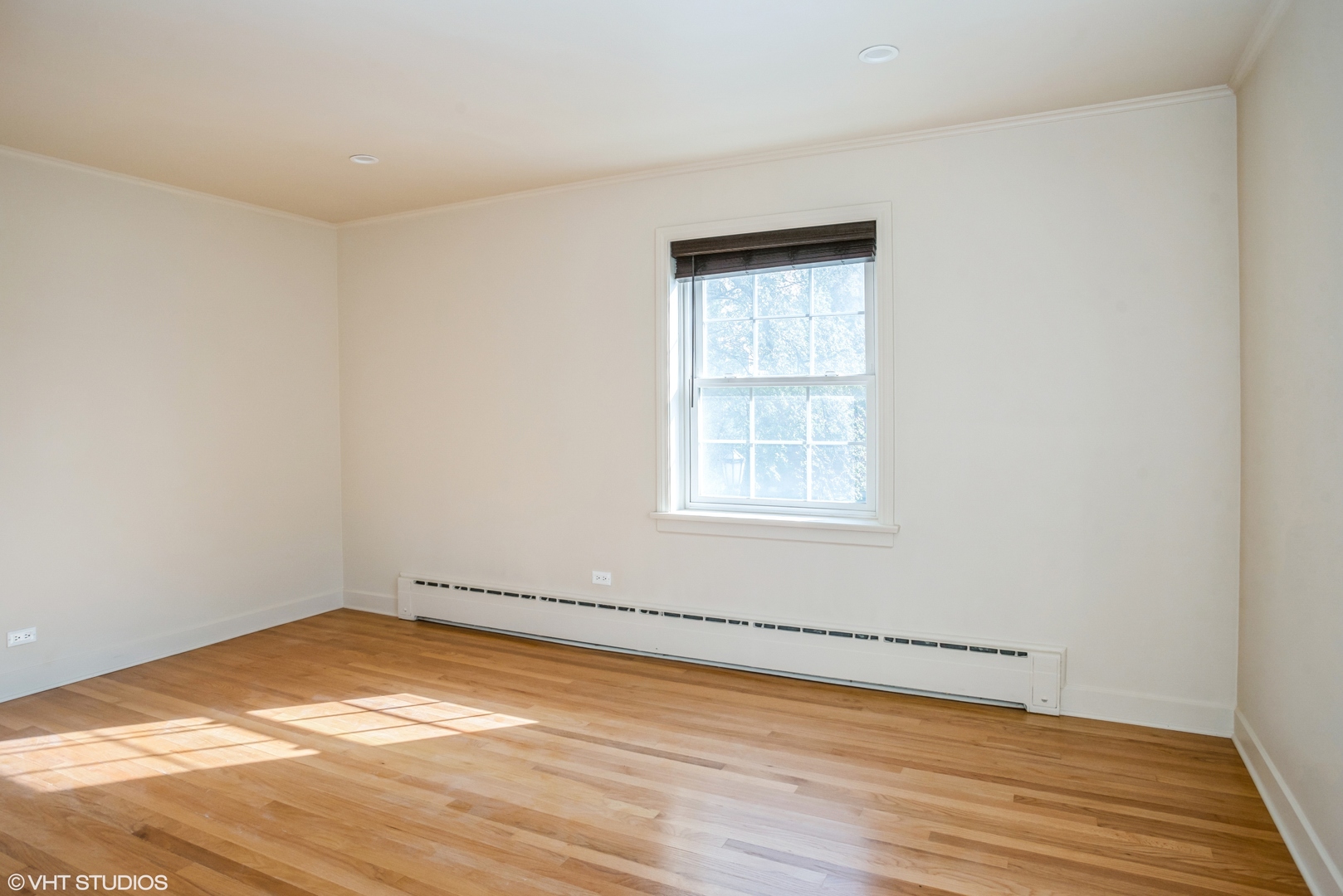 348 Ridge Avenue, Unit 2 Evanston, IL 60202 - Photo 12 of 16 a view of empty room with wooden floor and fan