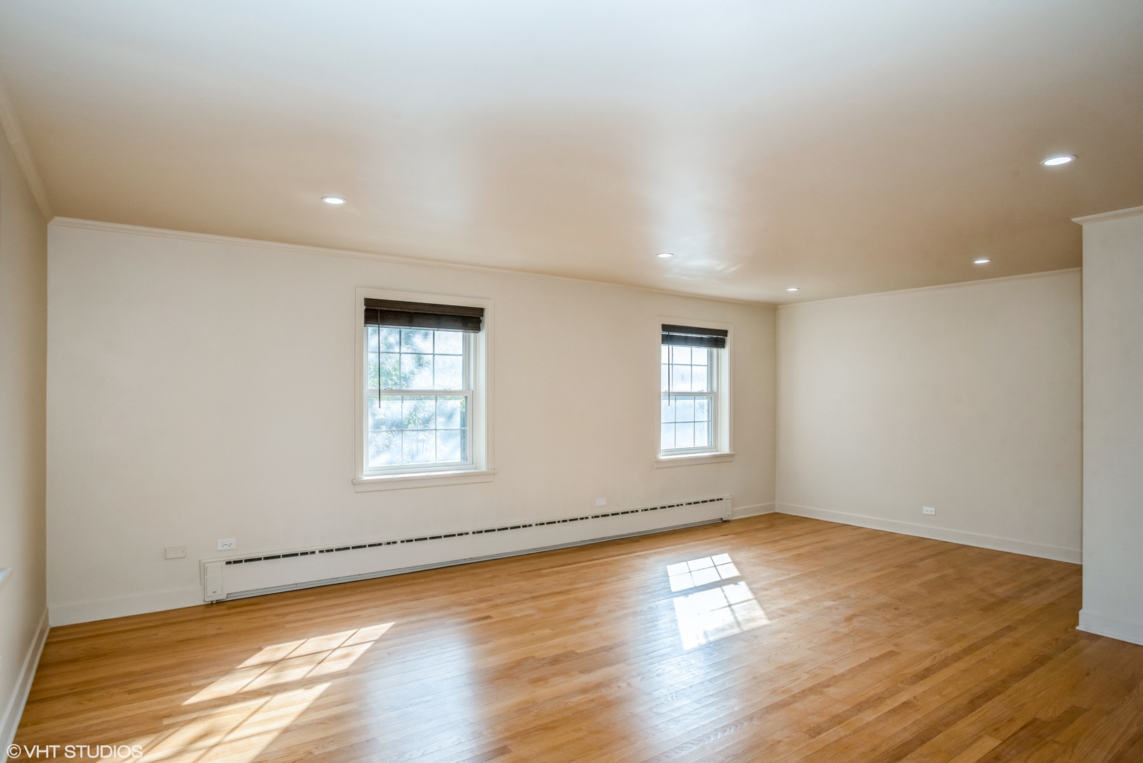 348 Ridge Avenue, Unit 2 Evanston, IL 60202 - Photo 5 of 16 a view of empty room with wooden floor and fan