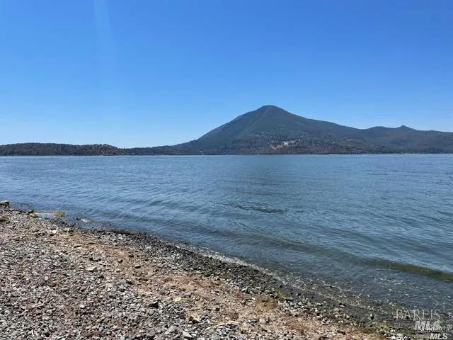 a view of an ocean and a mountain