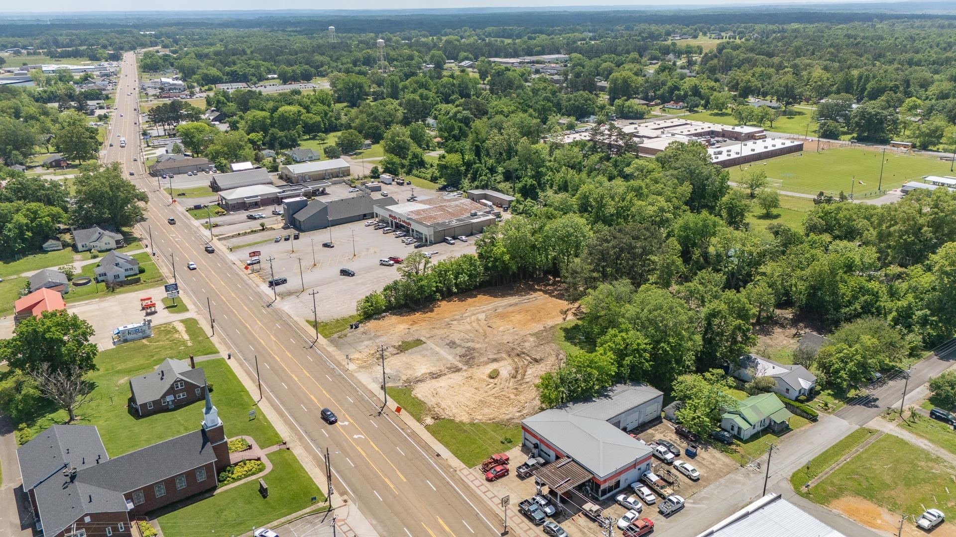 211 East Main Street Adamsville, TN 38310 - Photo 5 of 7 an aerial view of residential house with outdoor space and river