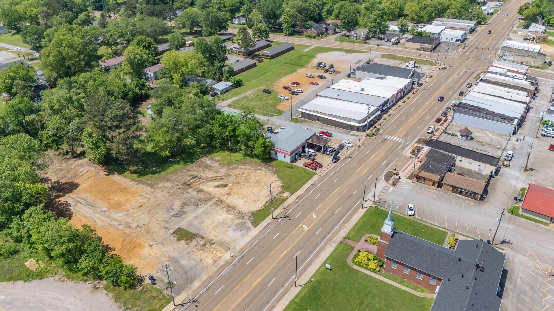 211 East Main Street Adamsville, TN 38310 - Photo 6 of 7 an aerial view of a house with a yard basket ball court and outdoor seating