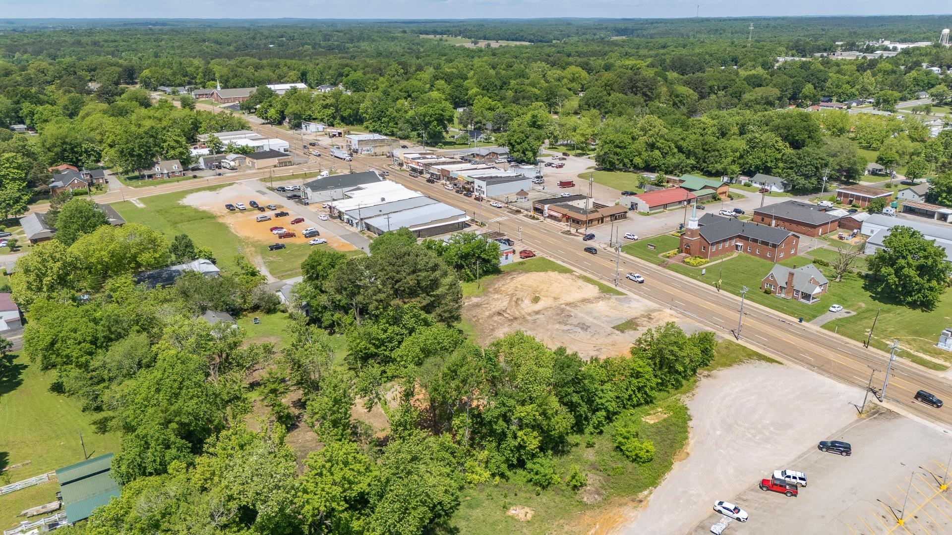 211 East Main Street Adamsville, TN 38310 - Photo 7 of 7 an aerial view of residential houses with outdoor space