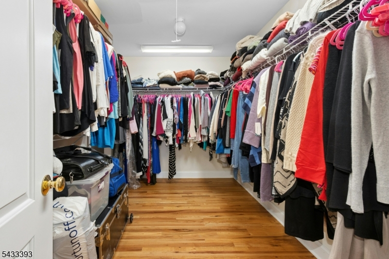 33 Stanton Street Clark, NJ 07066 - Photo 25 of 37 a view of walk in closet with clothes and shoes