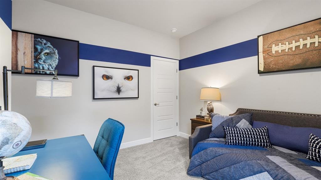 227 Windmill Drive Rhome, TX 76078 - Photo 22 of 34 a bedroom with furniture and a wooden floor