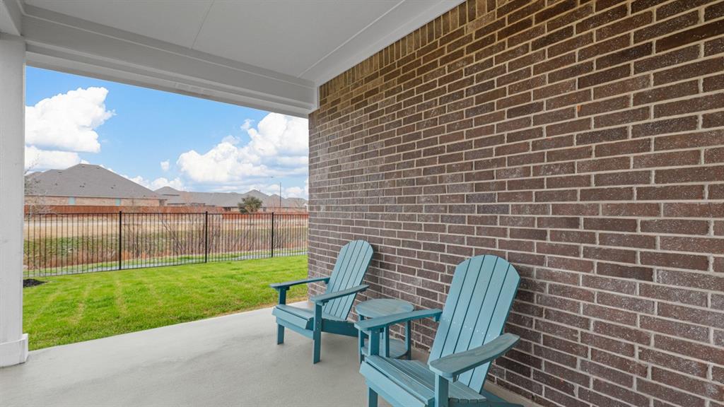 227 Windmill Drive Rhome, TX 76078 - Photo 33 of 34 a view of a chairs in backyard of the house