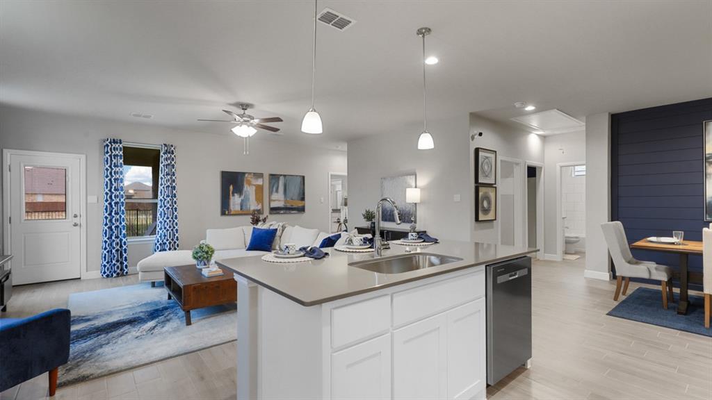 227 Windmill Drive Rhome, TX 76078 - Photo 2 of 34 a kitchen with a sink appliances and a living room
