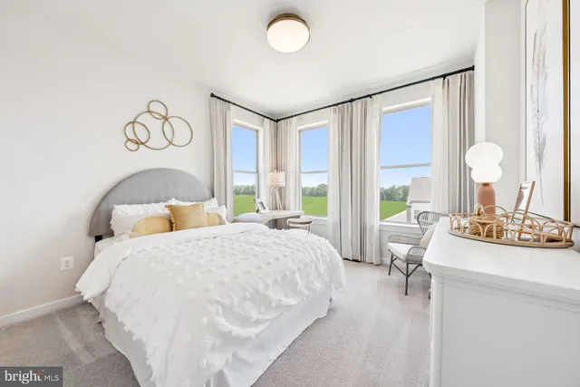 a bedroom with a bed and a table