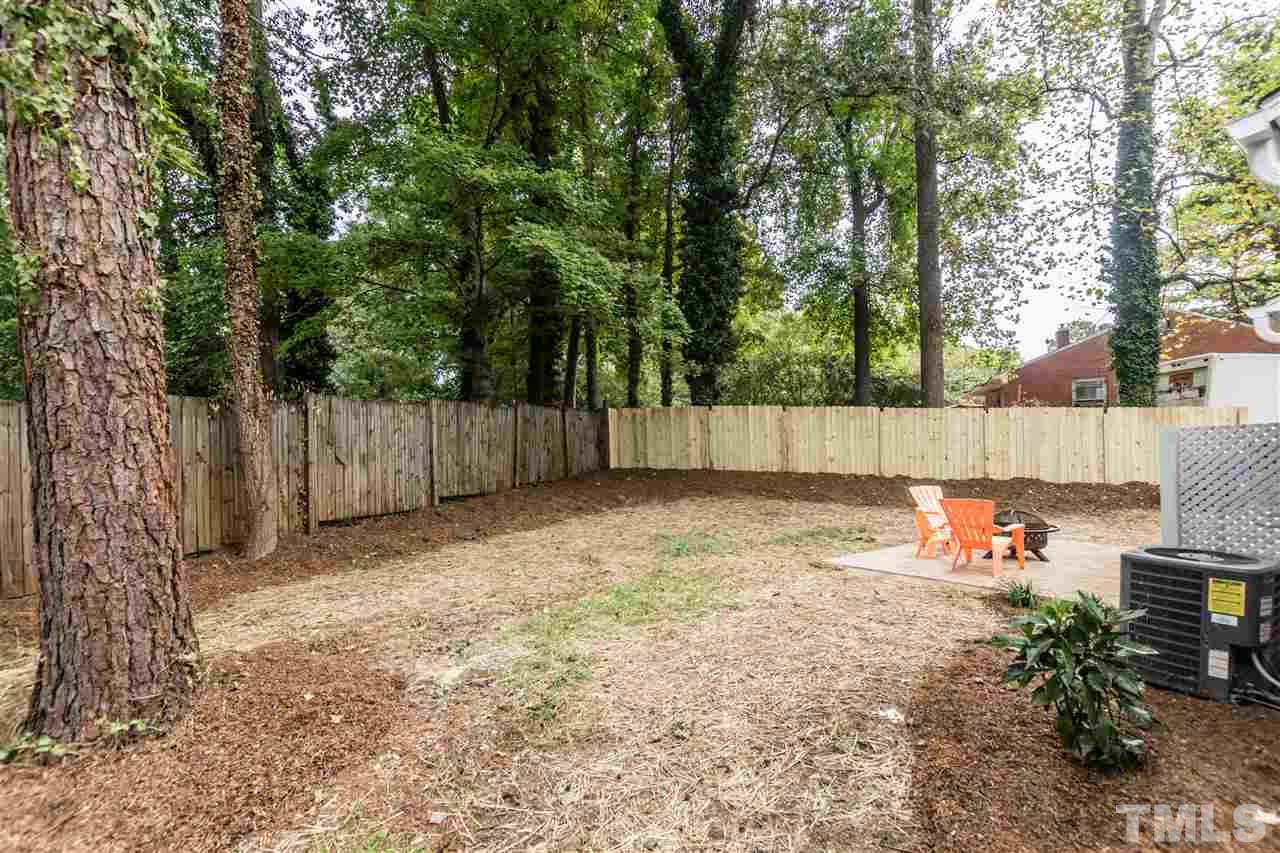 2401 Stevens Road Raleigh, NC 27610 - Photo 17 of 21 a backyard of a house with lots of green space