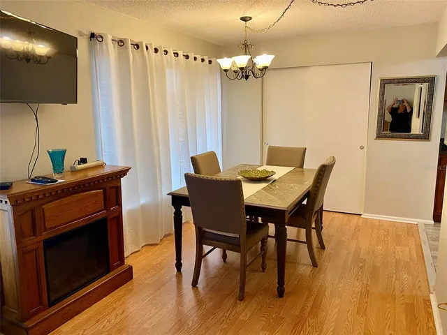 a view of an empty room with workspace and closet