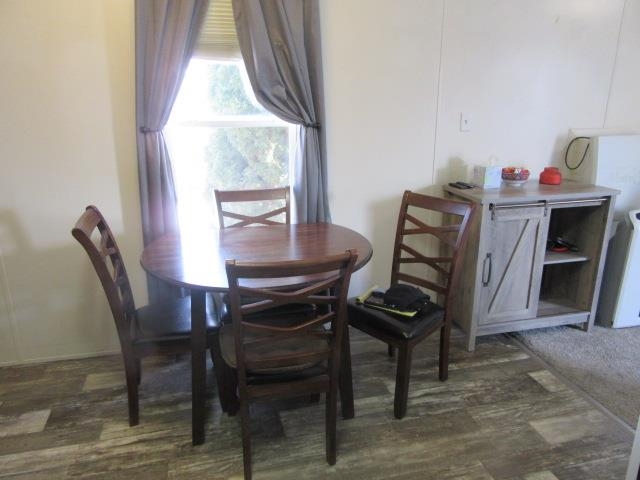3251 E Road, Unit 99 Clifton, CO 81520 - Photo 14 of 25 a view of a dining room with furniture and a window