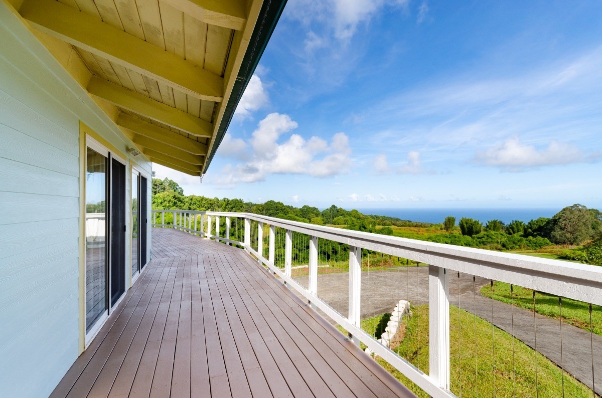2100 Kaiwiki Road Hilo, HI 96720 - Photo 12 of 29 a view of balcony with wooden floor and fence