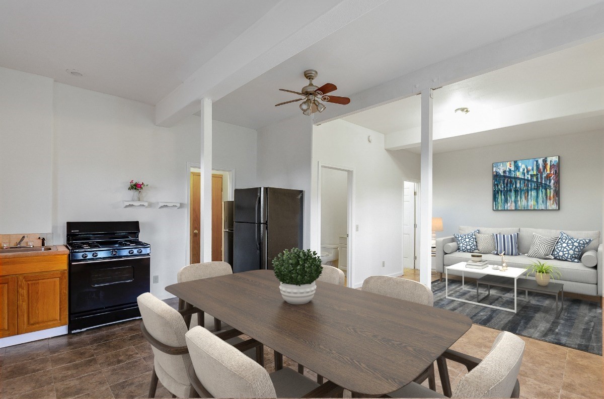 2100 Kaiwiki Road Hilo, HI 96720 - Photo 22 of 29 a view of a dining room with furniture a chandelier and wooden floor