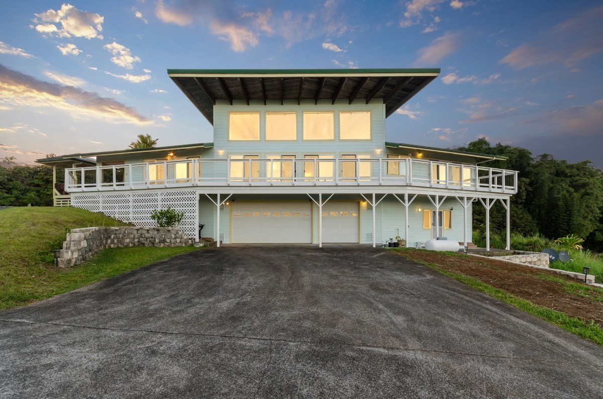 2100 Kaiwiki Road Hilo, HI 96720 - Photo 29 of 29 a front view of a house with a yard and garage