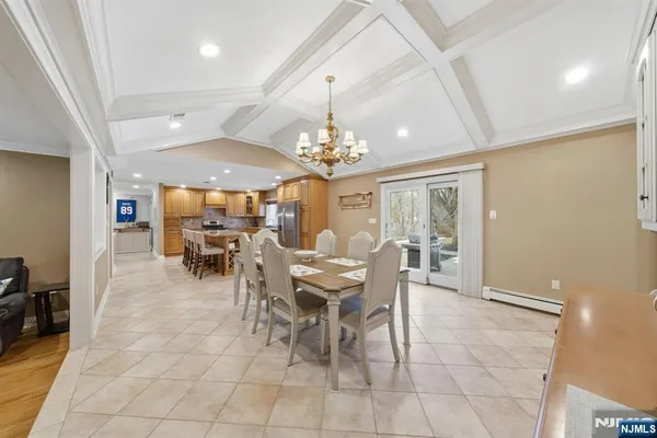 a view of a dining room with furniture and window