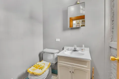 a bathroom with a sink toilet and vanity