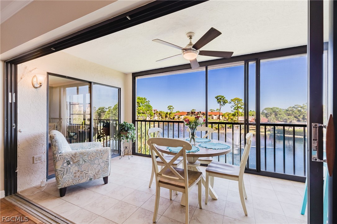 23465 Harbor View Road, Unit 734 Punta Gorda, FL 33980 - Photo 13 of 40 a dining room with furniture and a floor to ceiling window