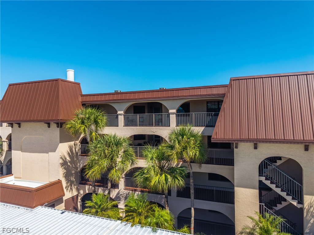23465 Harbor View Road, Unit 734 Punta Gorda, FL 33980 - Photo 2 of 40 a view of a chairs and table in the patio