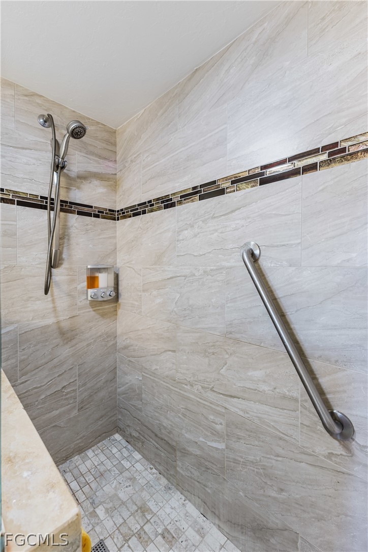 23465 Harbor View Road, Unit 734 Punta Gorda, FL 33980 - Photo 21 of 40 a bathroom with a shower