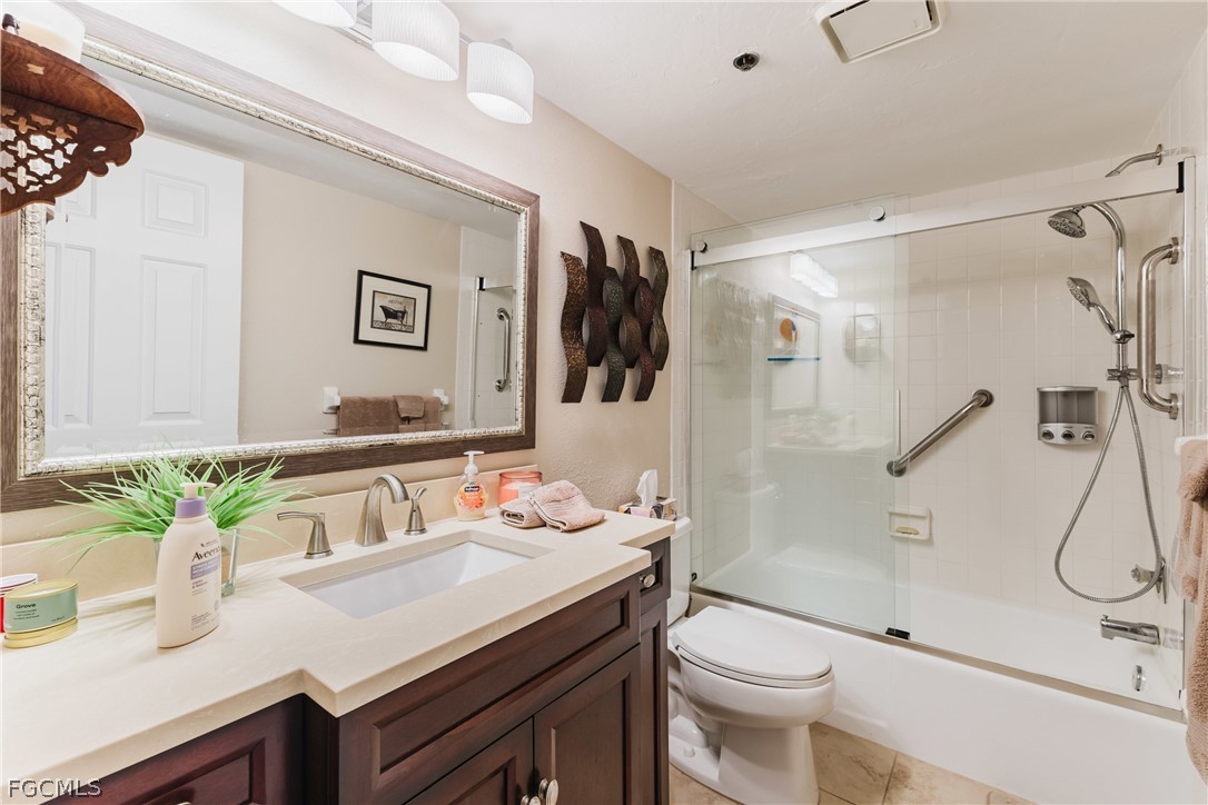 23465 Harbor View Road, Unit 734 Punta Gorda, FL 33980 - Photo 25 of 40 a bathroom with a sink toilet and shower