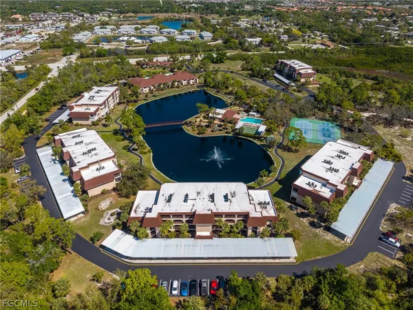 an aerial view of a swimming pool patio swimming pool and outdoor seating