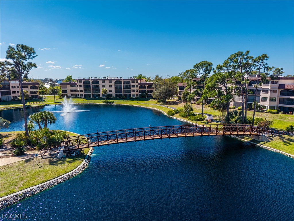 23465 Harbor View Road, Unit 734 Punta Gorda, FL 33980 - Photo 31 of 40 a view of a swimming pool with an outdoor space and seating area