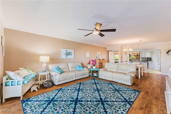 a living room with furniture and a rug