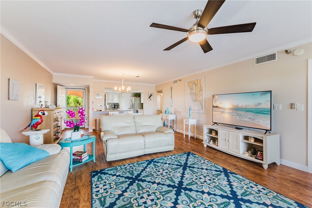 23465 Harbor View Road, Unit 734 Punta Gorda, FL 33980 - Photo 7 of 40 a living room with furniture and a flat screen tv