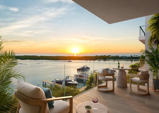 a view of a terrace with lawn chairs