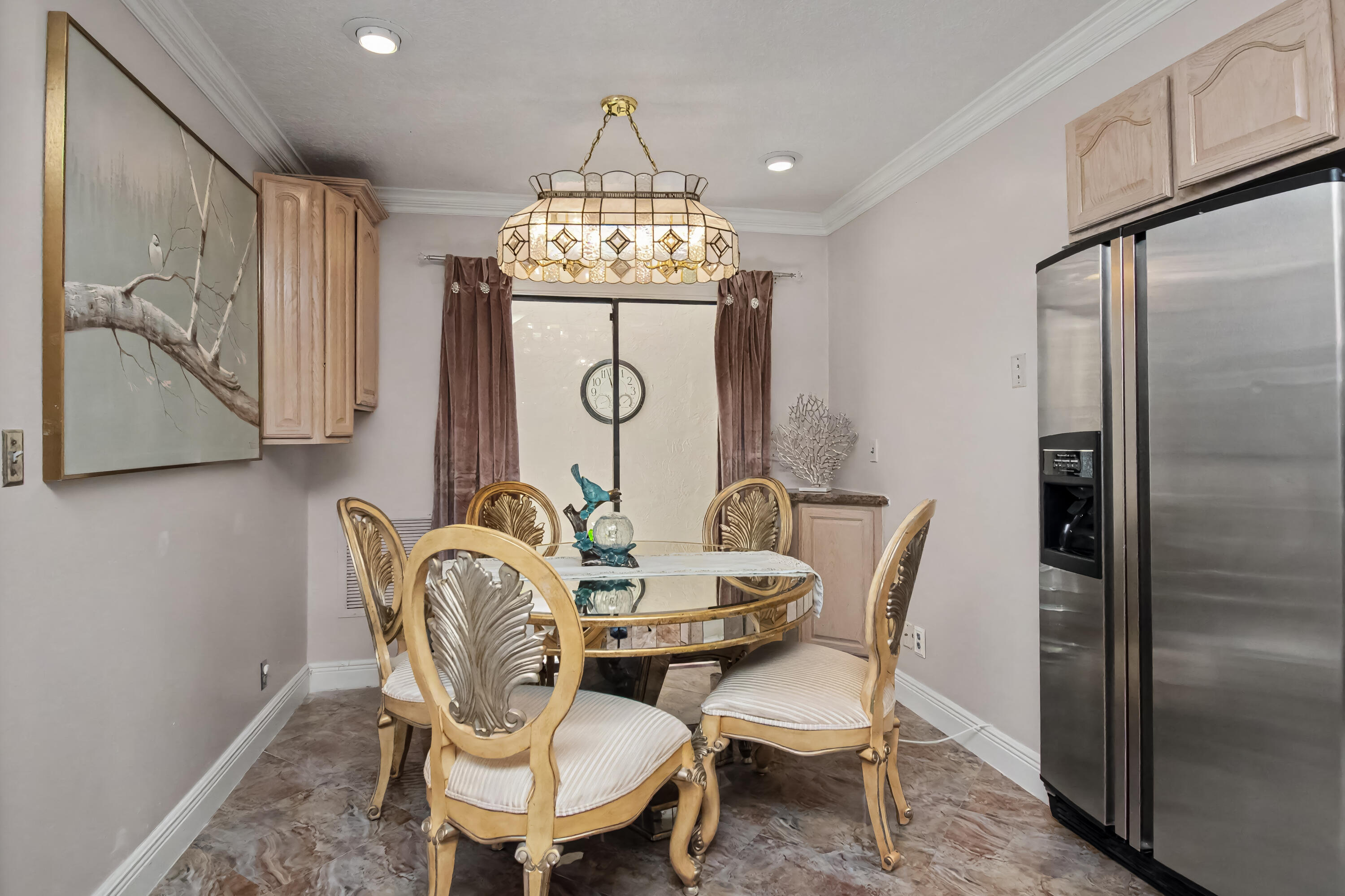 9708 Erica Court Boca Raton, FL 33496 - Photo 26 of 54 a view of a dining room with furniture window and wooden floor