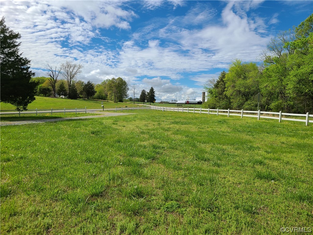 1174 Plank Road Farmville, VA 23901 - Photo 3 of 21 a view of a green field with wooden fence