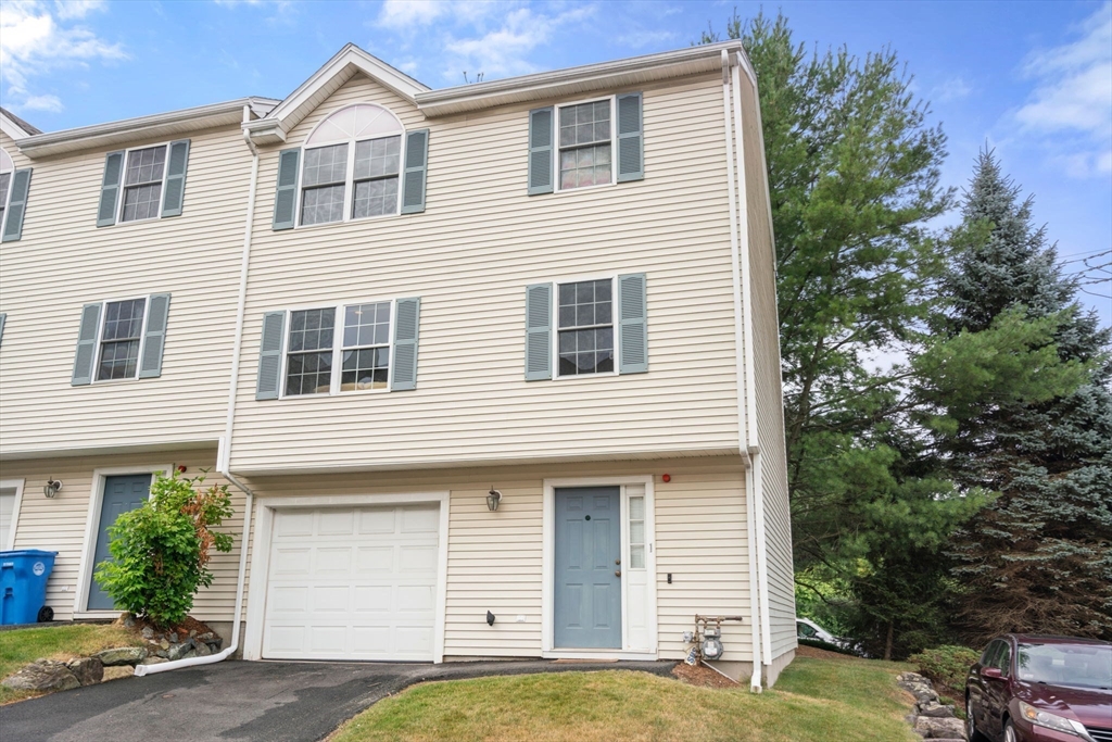 995 Trapelo Road, Unit 1 Waltham, MA 02452 - Photo 1 of 19 a view of a house with a yard
