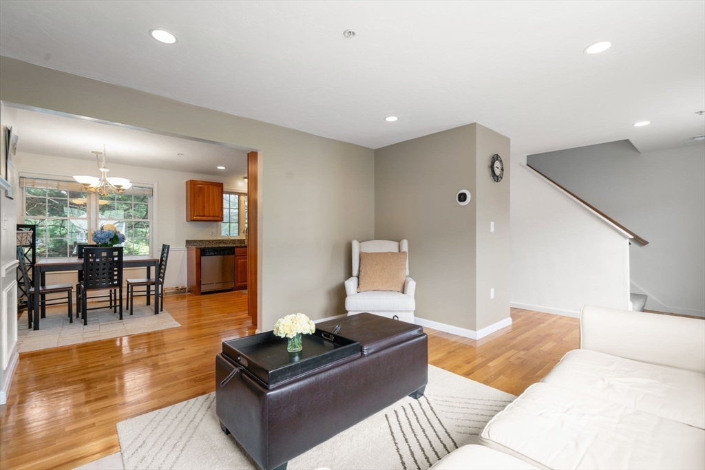 995 Trapelo Road, Unit 1 Waltham, MA 02452 - Photo 3 of 19 a living room with furniture and a wooden floor