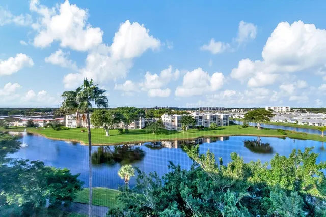 a view of a swimming pool and outdoor seating