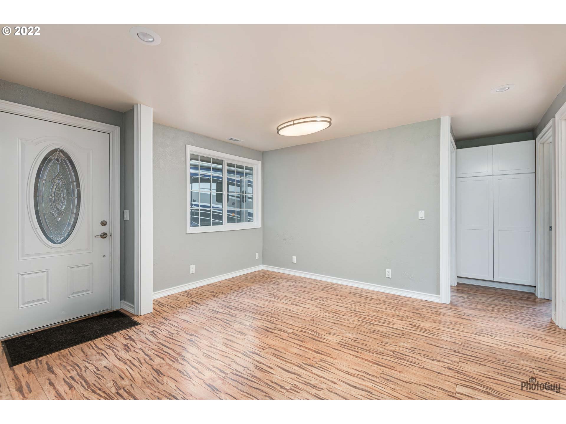 87533 Cedar Flat Road Springfield, OR 97478 - Photo 3 of 32 a view of an empty room with wooden floor and window