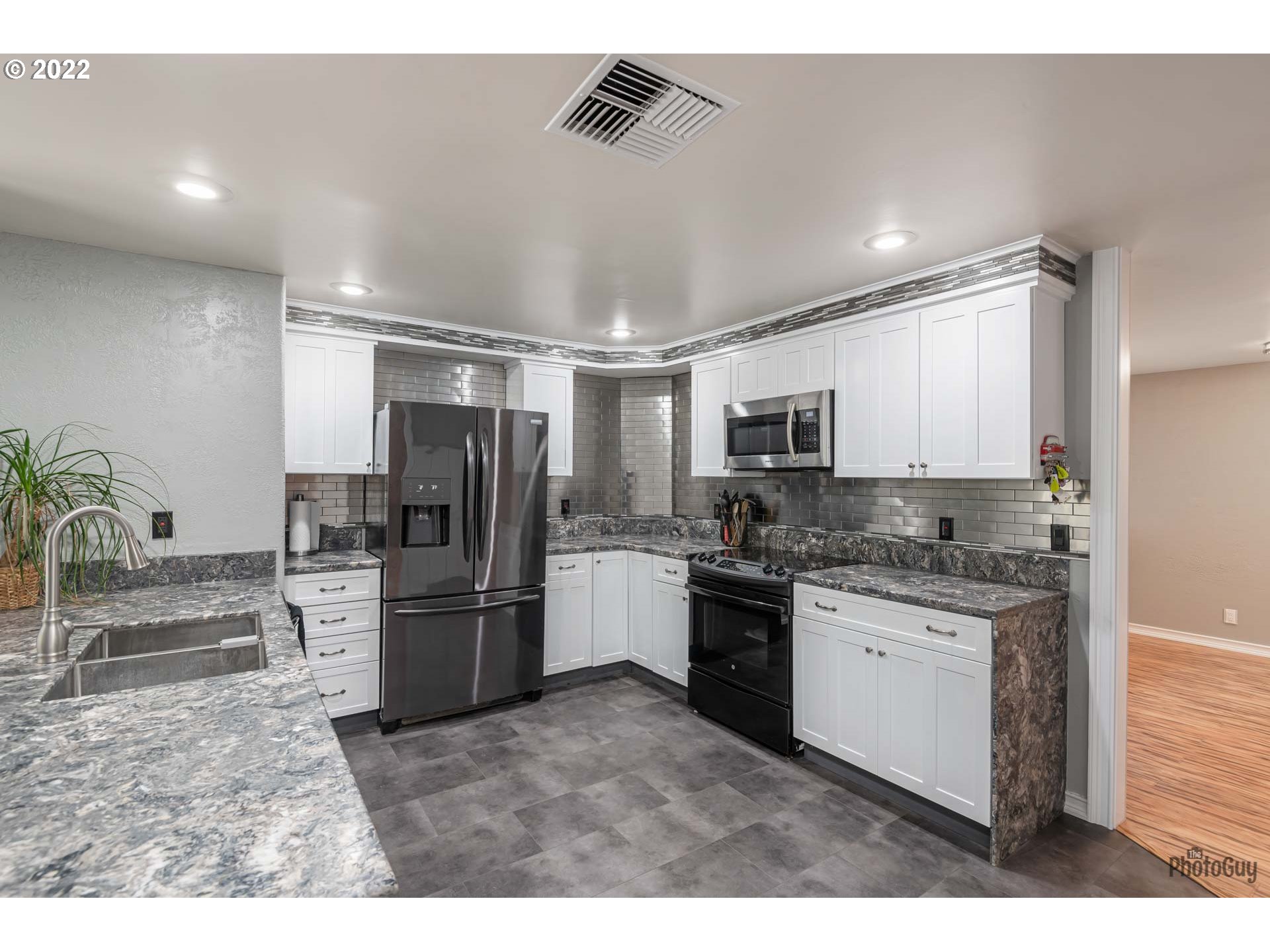 87533 Cedar Flat Road Springfield, OR 97478 - Photo 10 of 32 a kitchen with a refrigerator and a sink